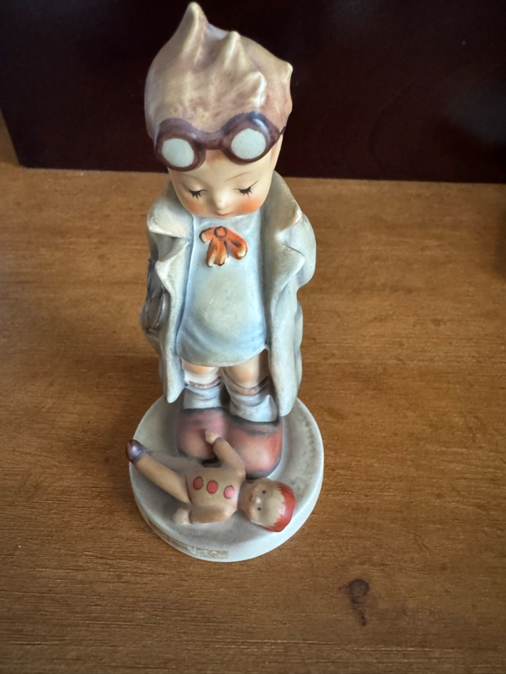 Hummel ceramic boy figurine in cream, blue and tan